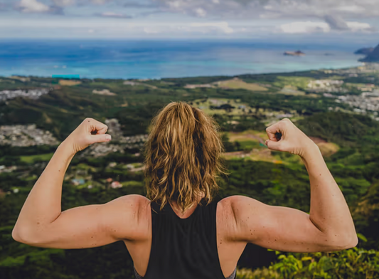 woman flexing in nature 